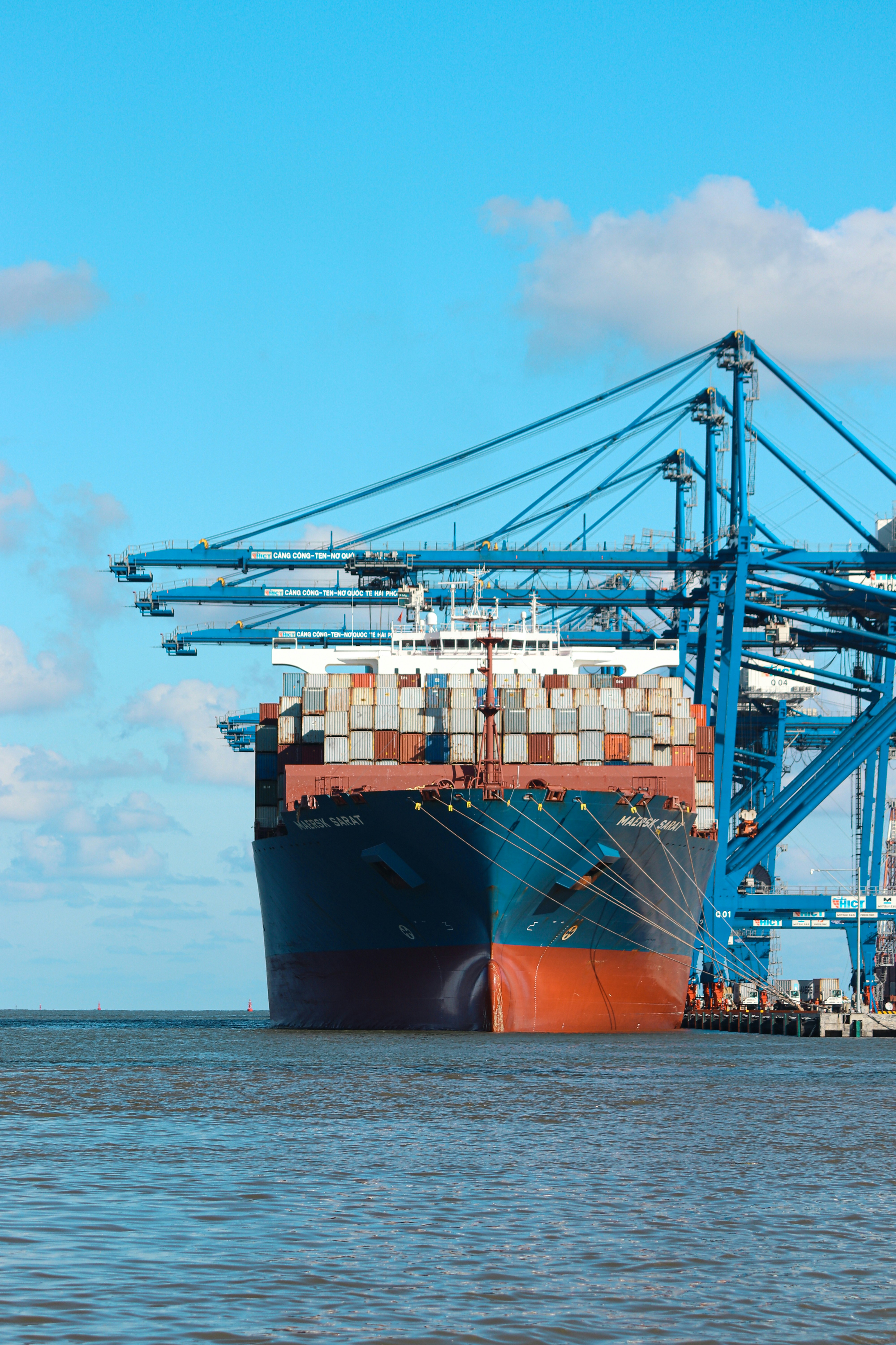 Container vessel at port representing trade finance and working capital movement